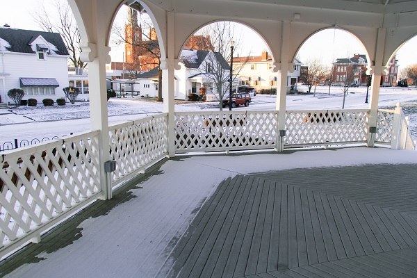 Looking off the edge of a gazebo at a snowy landscape
